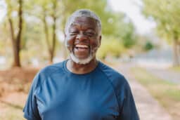 Smiling man in the park.